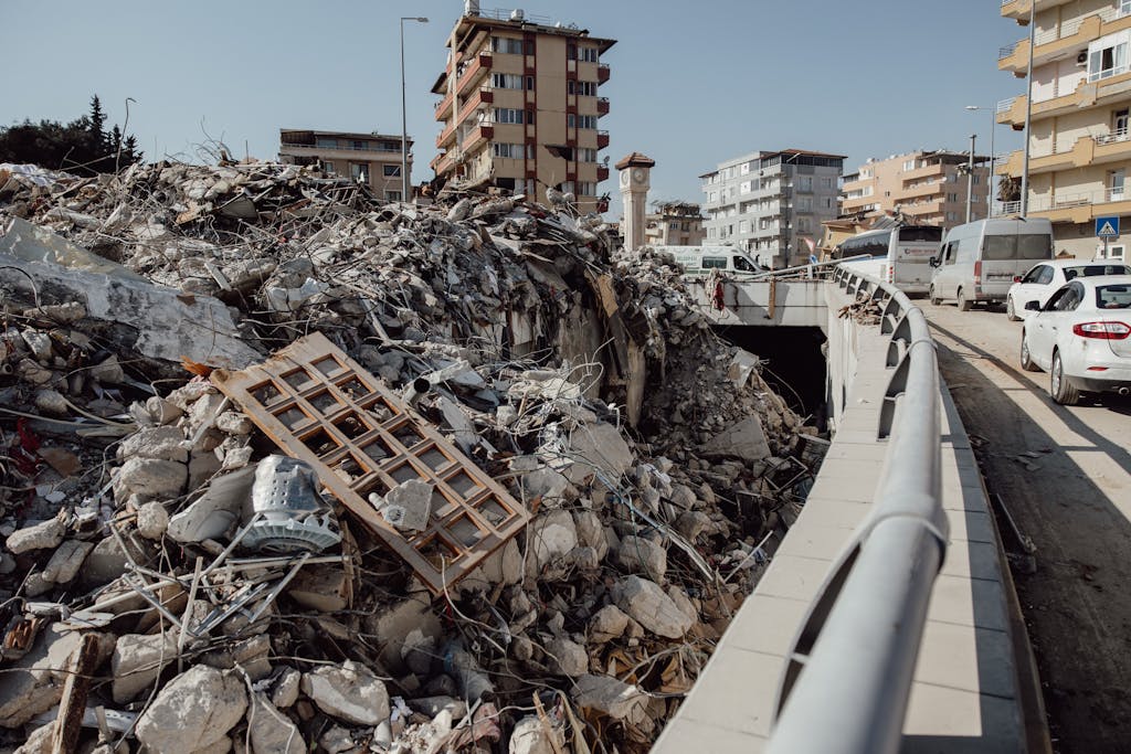 A city scene showing extensive earthquake damage with debris and ruins.