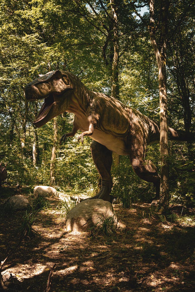 Realistic T-Rex dinosaur model amidst lush green forest, capturing prehistoric ambiance.